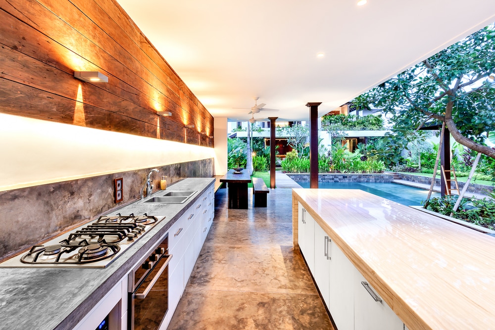 an open garden kitchen with a pool