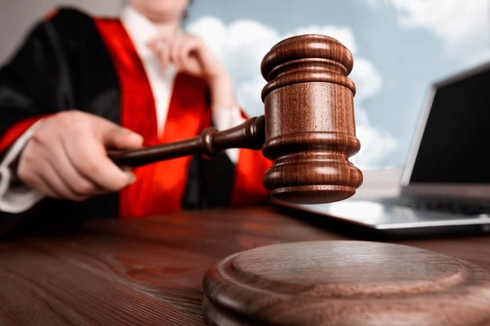 a judge in court smashing their gavel