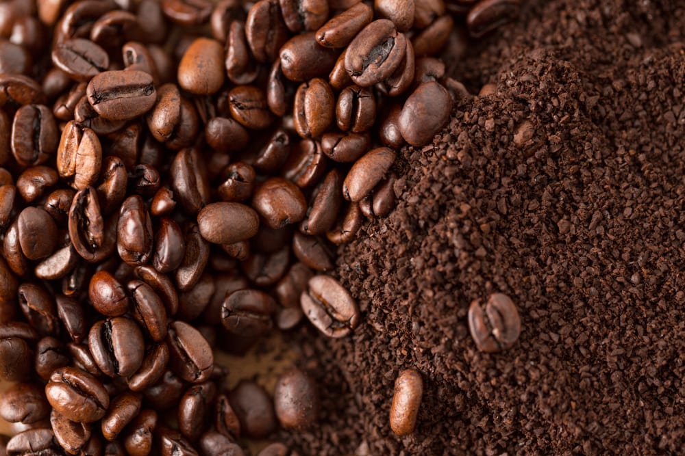 Coffee Beans and Grounds next to one another
